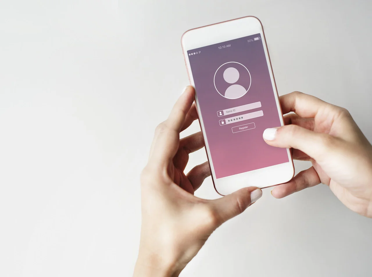 Hands holding a phone showing an account registration form